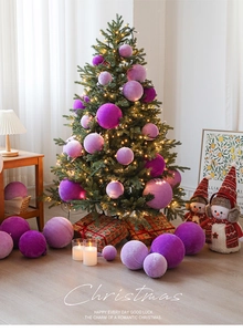 Detail of purple velvet Christmas ornaments with soft texture on a festive tree