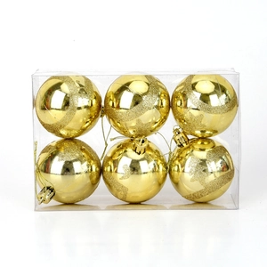 Macro shot of 6-pack 6cm gold Christmas ornaments with glitter deer and star patterns
