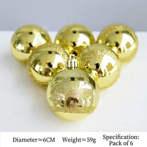Detail of 6cm gold Christmas balls with festive glitter patterns for tree decoration