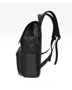 Side view detail of black geometric mosaic backpack with adjustable nylon straps