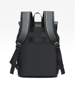 Detail view of ergonomic S-shaped shoulder straps and luggage strap on black backpack