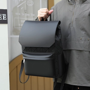 Detail of men's black business backpack featuring 3D geometric patchwork on side
