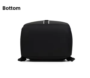 Flat bottom view of a black commuter laptop backpack showing reinforced stitching and fabric