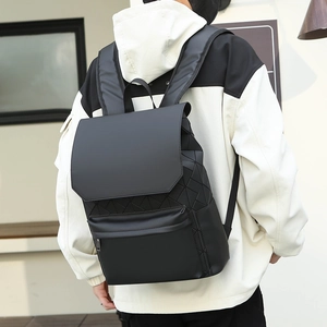 Detail of a black geometric 3D triangle pattern backpack with ergonomic straps