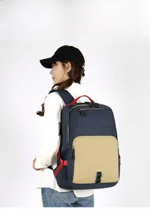 Detail of blue and khaki water-resistant nylon commuter backpack with side mesh pocket