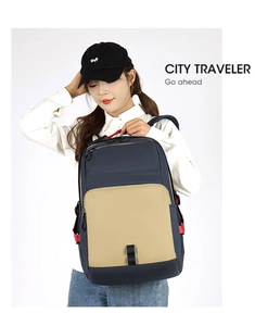 Detail of city commuter backpack with navy and beige stitching and red strap accents