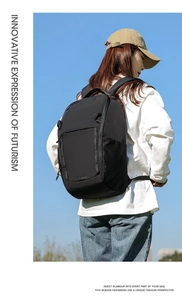 Outdoor shot of a woman wearing a black waterproof nylon backpack with mesh side pockets