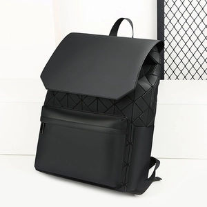 Macro detail of black geometric mosaic backpack with matte triangle pattern finish