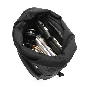 Interior view of black geometric laptop backpack with padded compartment and organized storage