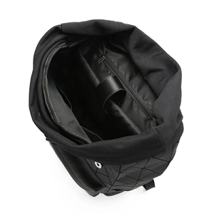 Top view of spacious interior compartments and laptop sleeve of this black geometric backpack