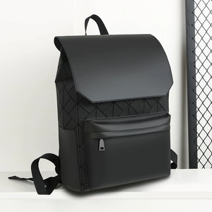 Detail view of the geometric textured side and matte finish of the black backpack