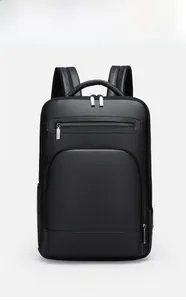 Front view of black pebble leather business backpack with silver zippers and clean design