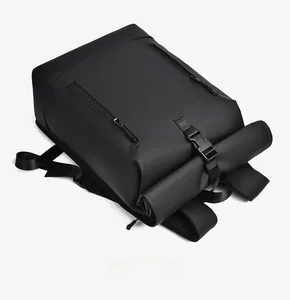 Top view of black roll-top laptop backpack showing waterproof zippers and buckle closure