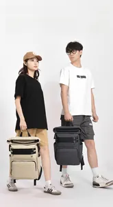 Detail of cream and dark grey insulated picnic backpacks with roll-top closure for camping