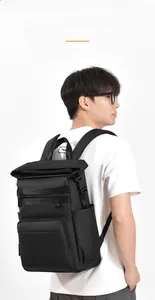 Close-up of the ergonomic breathable mesh back panel on a waterproof travel backpack