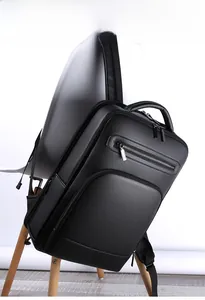 Detail of premium black lychee pattern leather backpack showing texture and front zipper