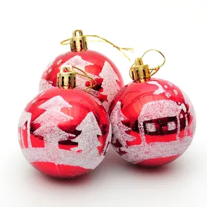 Three red Christmas balls with white glitter snow scene and gold hooks for tree decor