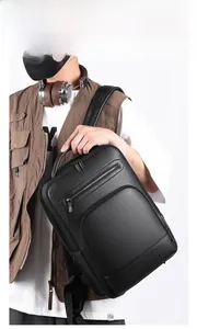 Men's black PU leather business backpack shown on model with large main compartment