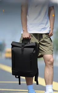 Detail of black roll-top laptop backpack with waterproof fabric and vertical zippers