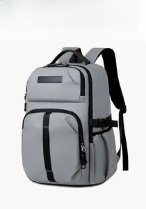 Three-quarter view of a gray water-resistant laptop backpack with black zipper details