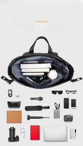 Flat lay of 28L black waterproof thermal backpack showing interior compartments and storage