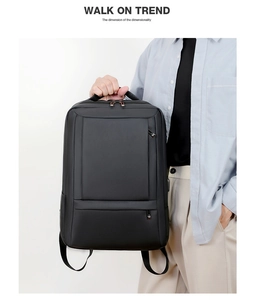 Detail of black business laptop backpack with matte finish and multiple zip pockets