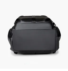 Macro detail of the durable flat bottom base of a black nylon large capacity backpack
