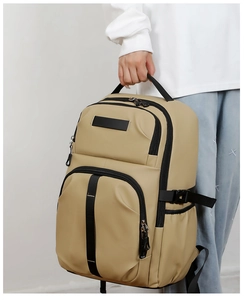 Detail of khaki large capacity backpack with waterproof fabric and side buckles