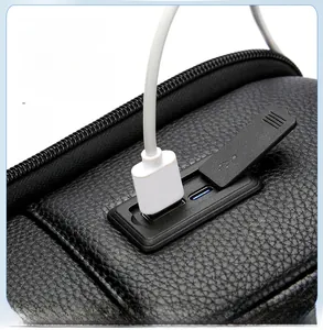 Detail of black faux leather backpack with dual USB and Type-C charging ports