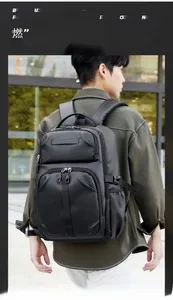 Detailed view of black multi-functional backpack with mesh straps and side buckles