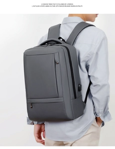 Side view of gray business backpack with built-in USB charging port for laptops