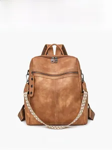 Front view of brown vintage leather backpack with geometric woven shoulder strap