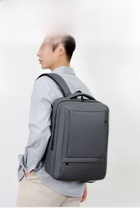 Deep grey business laptop backpack with ergonomic straps shown from side view on model