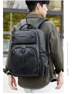 Close-up of high-density waterproof fabric and adjustable buckles on the black backpack