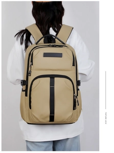 Macro view of khaki business casual backpack with textured fabric and side compression straps