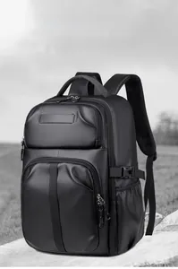 Close-up of waterproof textured fabric and side buckle on black large-capacity backpack