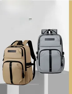 Detail of khaki and grey multipurpose nylon backpacks with functional zipper compartments
