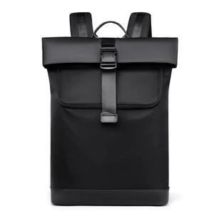 Minimalist black waterproof backpack with fold-over top and buckle for daily commuting