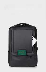 Detail of black business backpack showing front hidden pocket and side phone storage slot