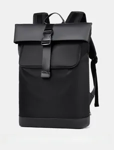 Detail view of the black roll-top backpack with buckle closure and side zipper pocket