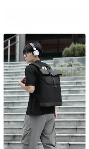 Detail of waterproof nylon backpack with roll-top closure and adjustable buckles for men