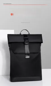 Detail of waterproof nylon commuter backpack featuring a black flap top and buckle closure
