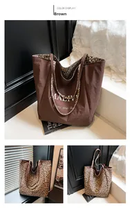Detail showing the reversible brown and leopard print tote bag with MALIVI branding