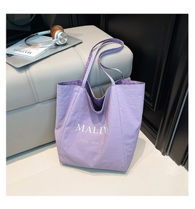 Detail of purple tote bag showing spacious leopard print interior and MALIV print