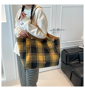 Detail of British style yellow plaid tote bag with our fave decorative leather label