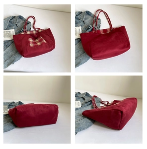 Macro detail of wine red suede tote bag showing plaid inner lining and side pocket view