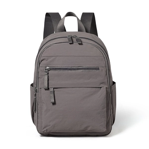 Minimalist lightweight dark grey backpack with multiple compartments for travel and daily use
