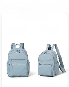 Front and side views of a lightweight light blue backpack with durable zipper pockets