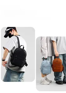 Minimalist lightweight backpack detail featuring black, light blue, and orange colors