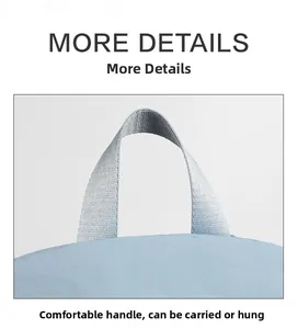Close-up of a durable grey nylon top handle on a light blue backpack with woven texture
